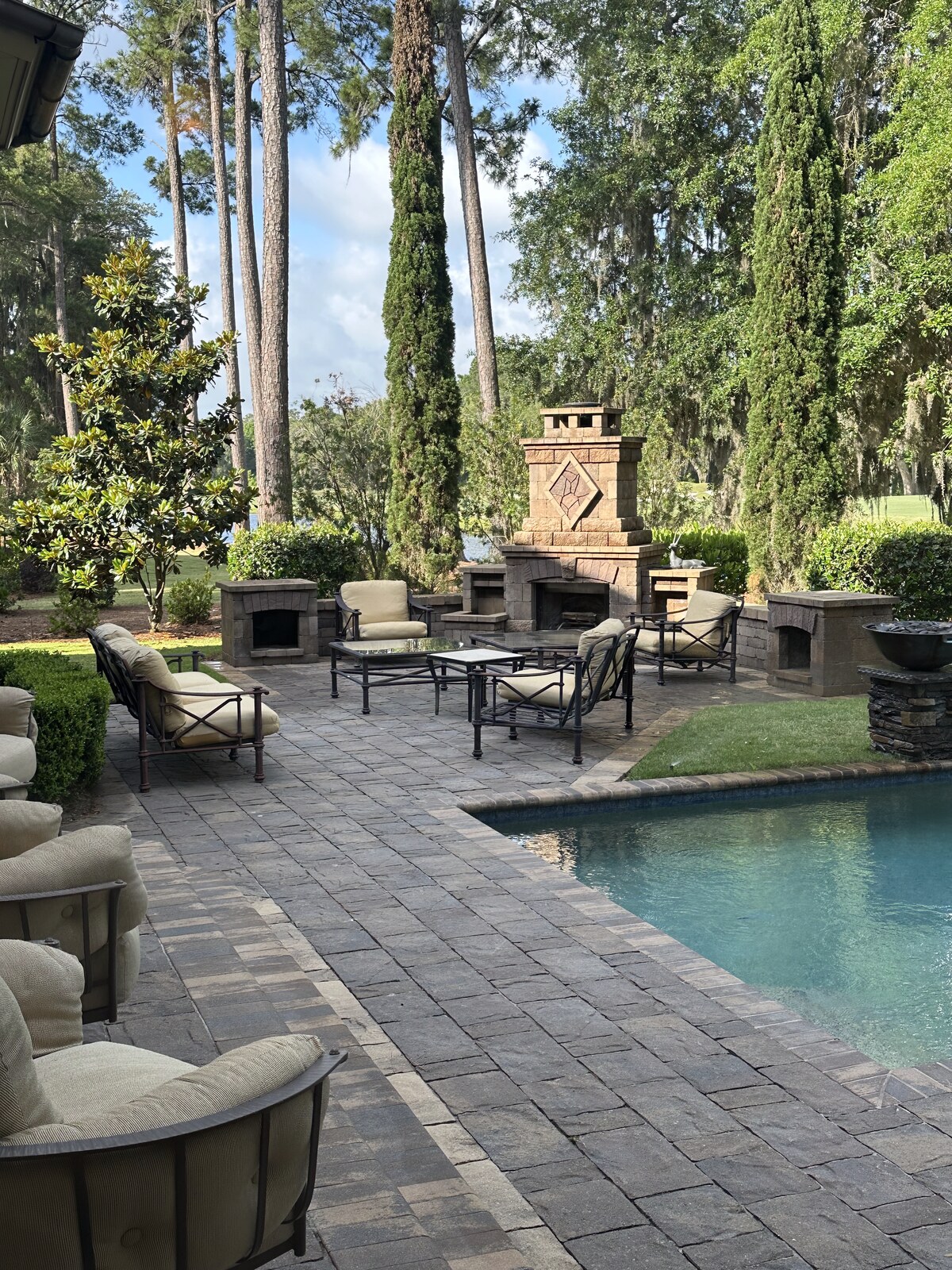 Poolside patio with stone fireplace